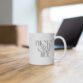 White ceramic mug with handwritten word “PHOTOGRAPHER” 15 oz
