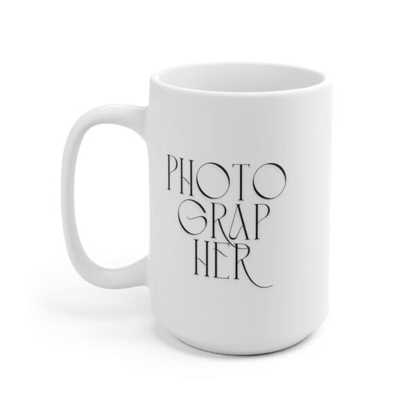 Overhead view of mug with coffee inside and a photo book nearby