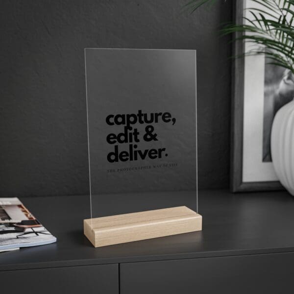 Minimalist sign for photographers, acrylic with wooden stand, styled on a modern desk