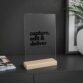 Minimalist sign for photographers, acrylic with wooden stand, styled on a modern desk