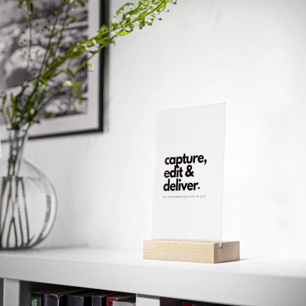 Acrylic desk sign with quote 'Capture. Edit. Deliver.' in wooden base, perfect for photographers