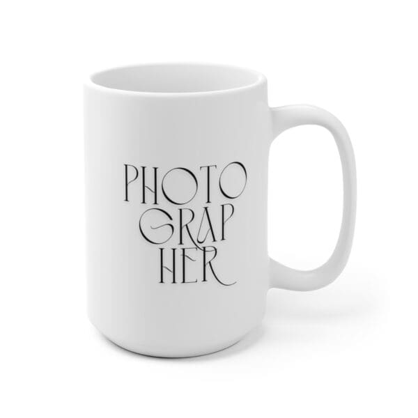 Overhead view of mug with coffee inside and a photo book nearby